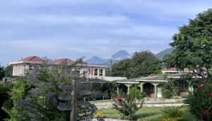 The IMA School campus in Guatemala with a volcano rising behind the classrooms
